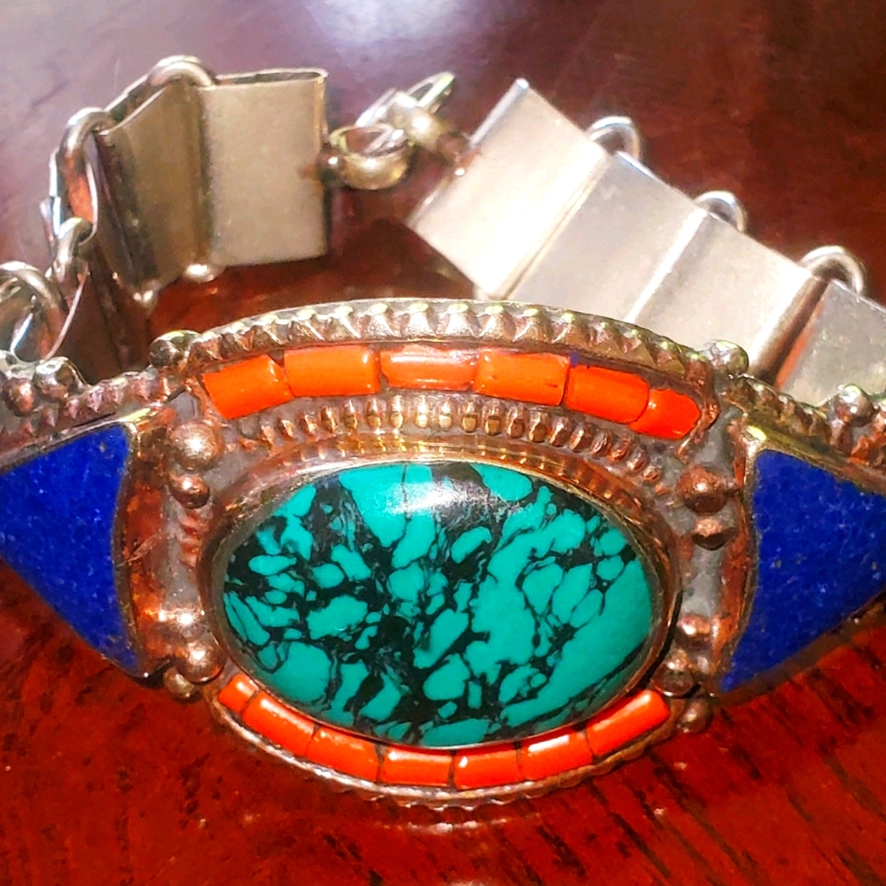 A wide Tibetan Inlay of Stones Shield Bracelet